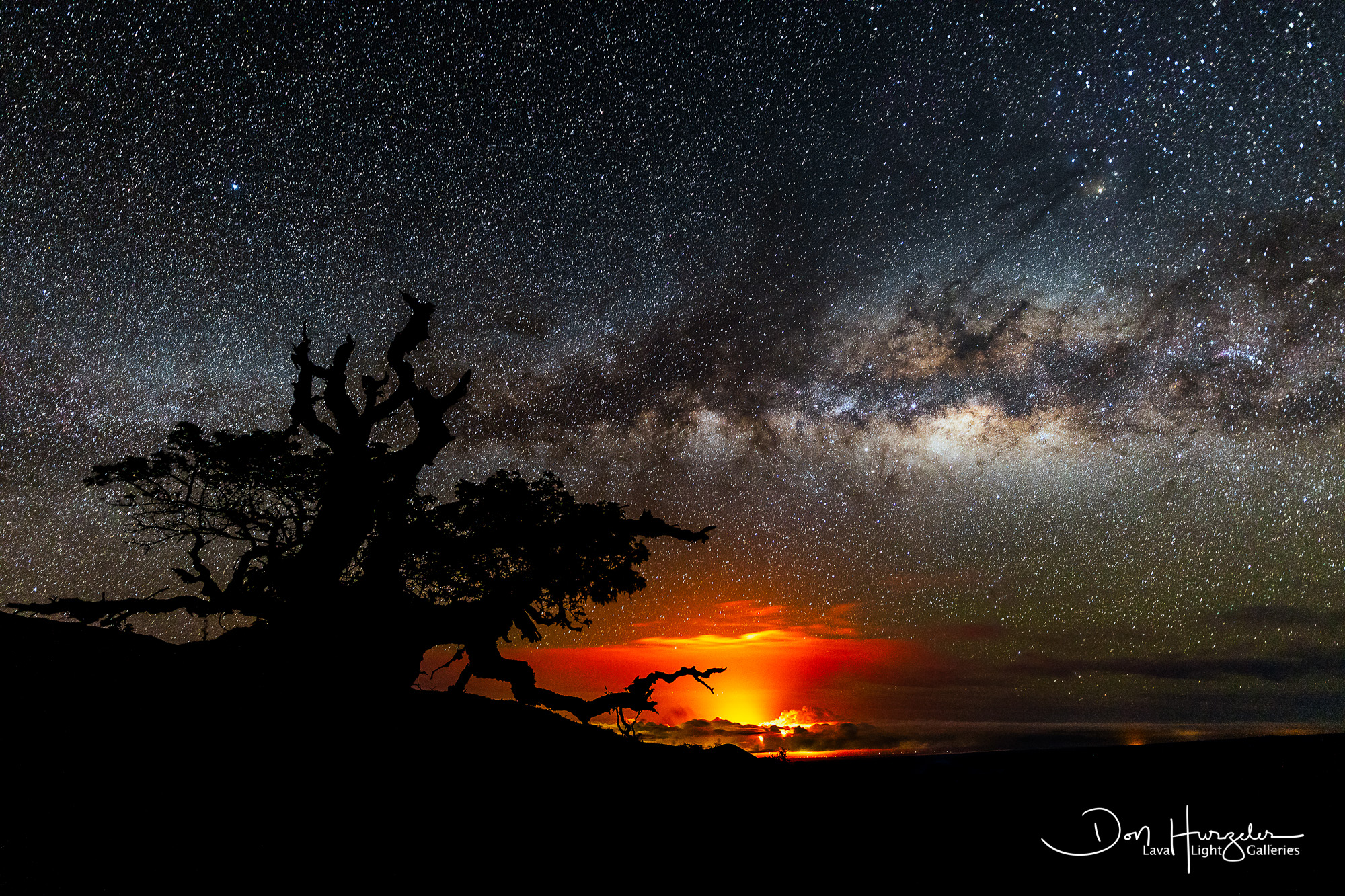 Puna by Night Taken maybe 30 miles away at 8500 feet up Mauna Kea...Milky Way over the Puna eruption.