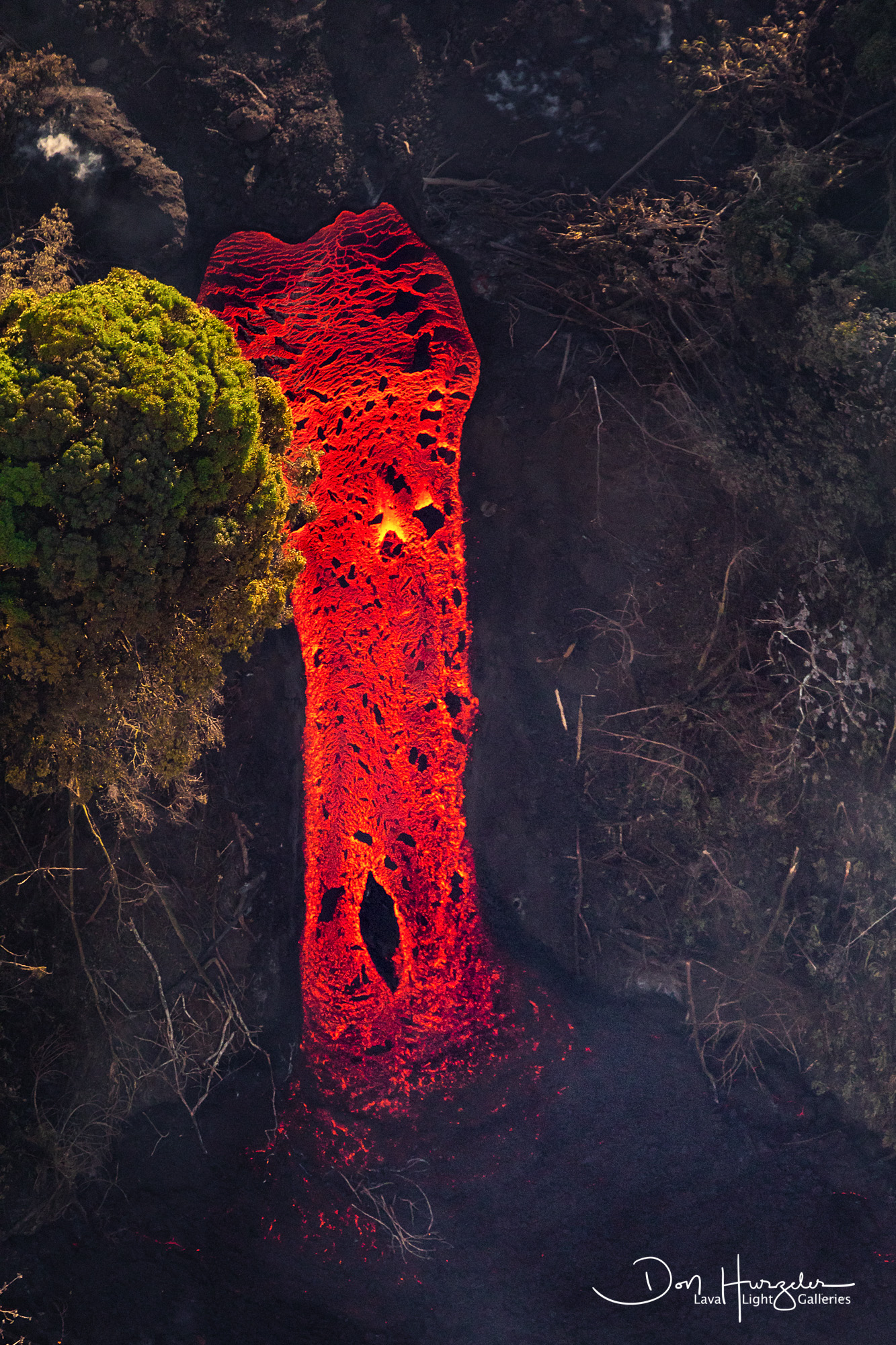 Lava Fall at Green Lake This is the famous "Lava Waterfall" taken from 3000 feet up with a 600mm lens from a helicopter over Green Lake, Hawaii. Estimated...