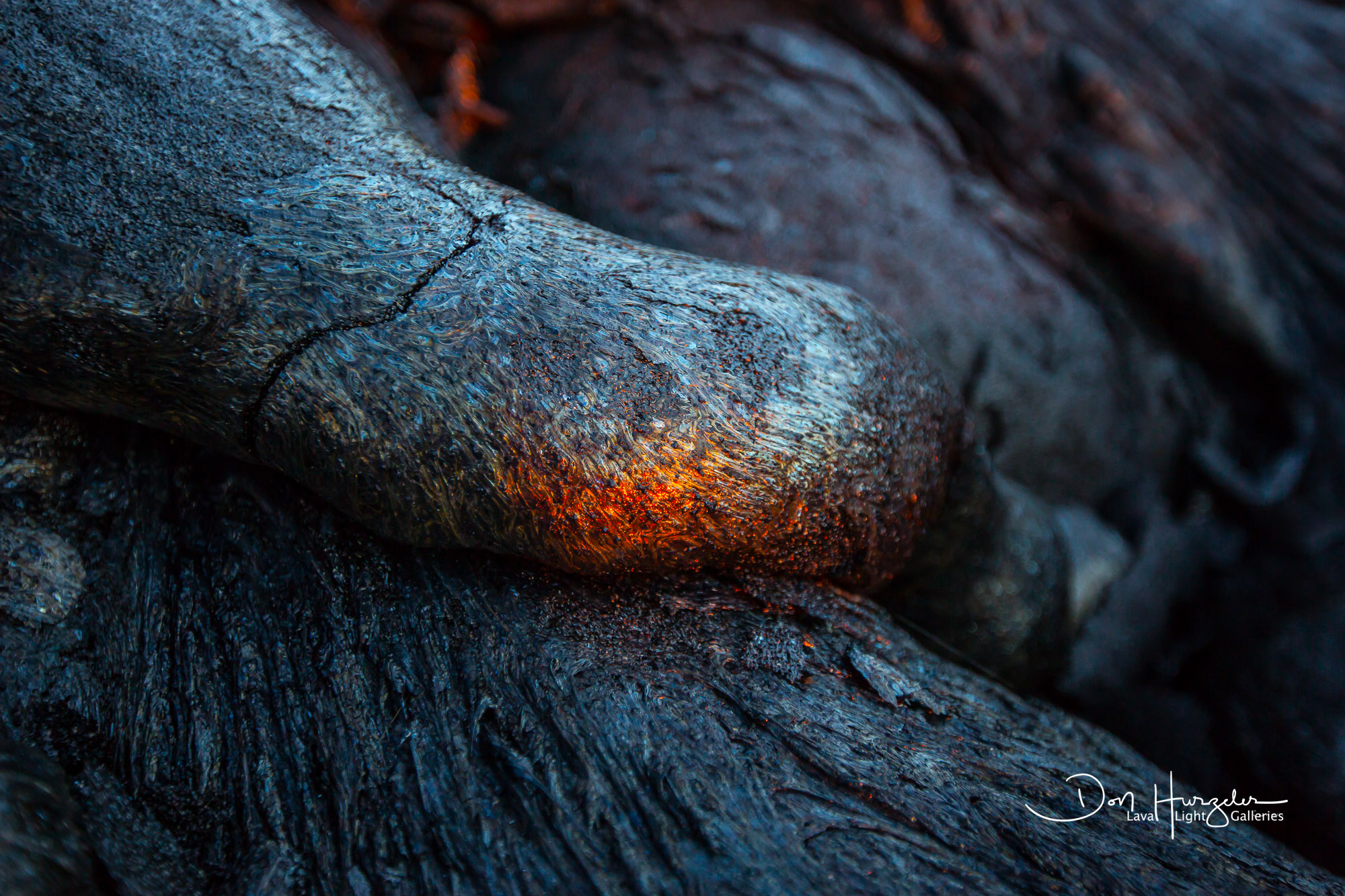 Reflecting Lava Looks like hot lava, but it is not. Old lava with the sun reflecting off of it at sunrise.